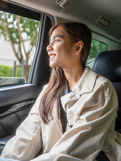Female guest enjoying car transfer from Tirana, looking out the window.
