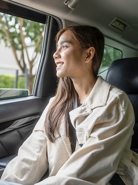 Female guest enjoying car transfer from Tirana, looking out the window.