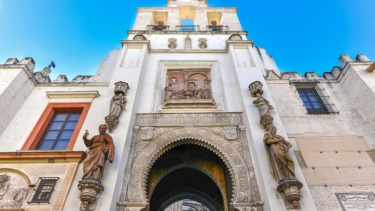 Seville Cathedral's Door of Forgiveness with intricate carvings and historical significance.