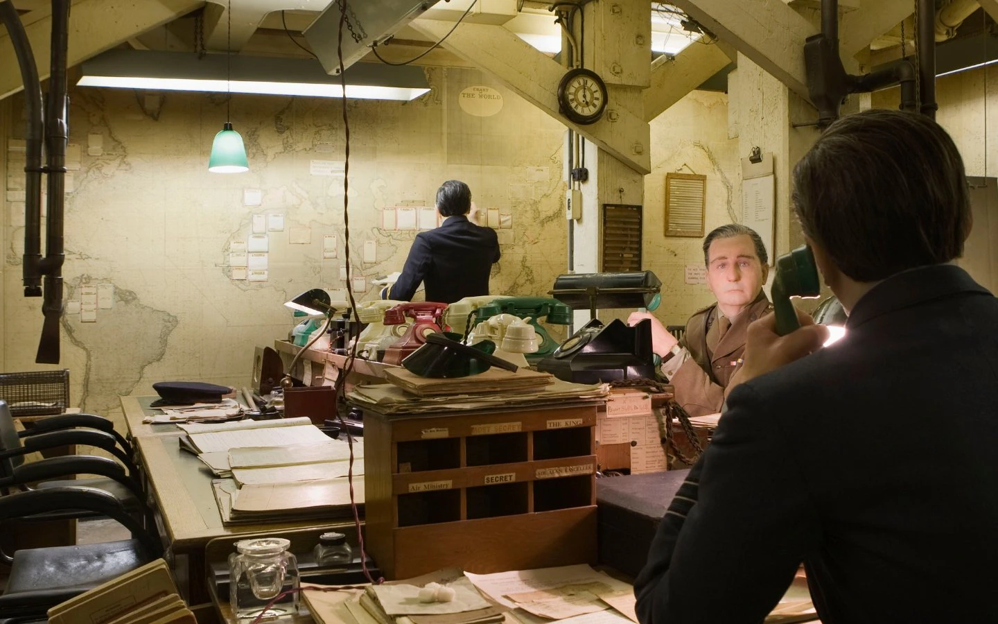 Churchill War Rooms museum with historical office setup and vintage telephones.
