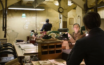 Churchill War Rooms museum with historical office setup and vintage telephones.