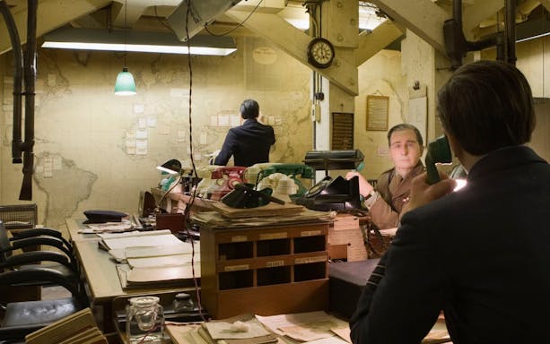 Churchill War Rooms museum with historical office setup and vintage telephones.