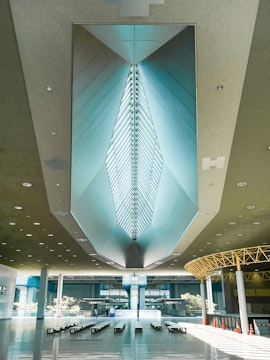Kansai Airport terminal interior with modern architectural ceiling design.