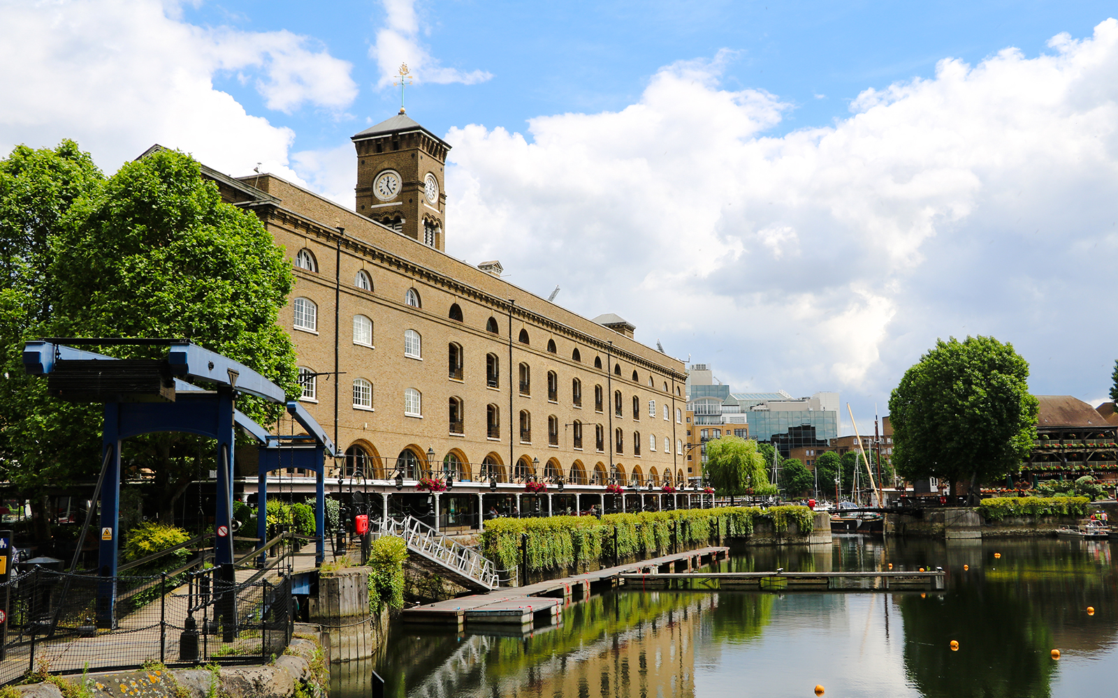 St Katharine Docks with historic warehouse and marina in London.