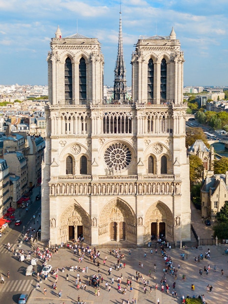 Notre Dame Cathedral in Paris with surrounding cityscape and Seine River.