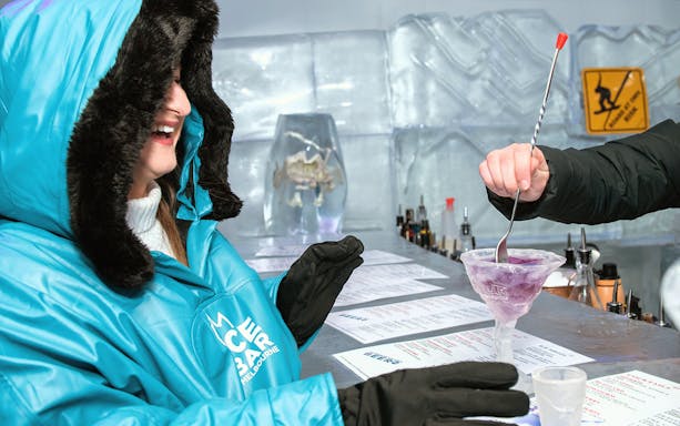 Guests at IceBar Melbourne enjoying a drink in an ice glass.