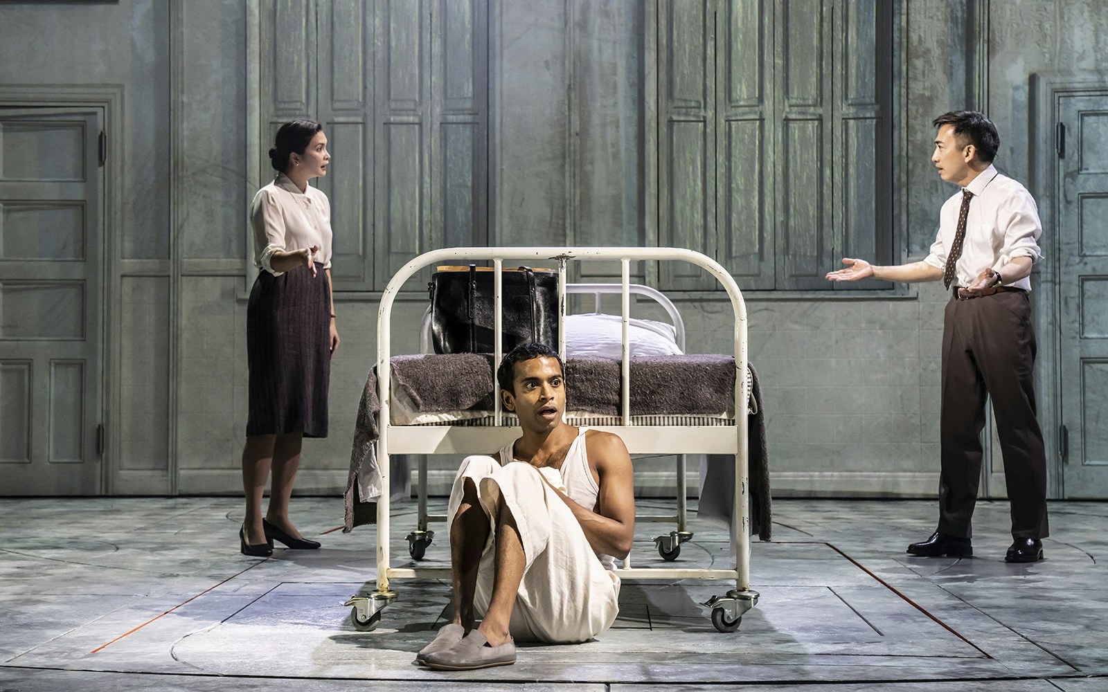 Theater scene from Life of Pi with three actors in a hospital room setting.