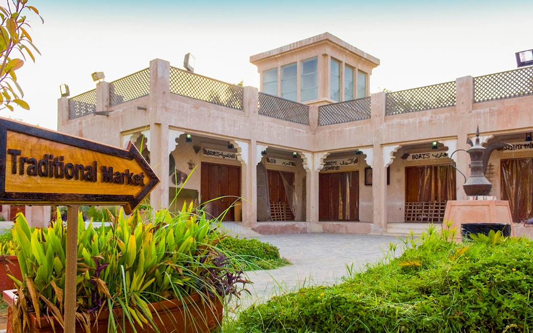 Traditional market sign and buildings in Heritage Village, Abu Dhabi.