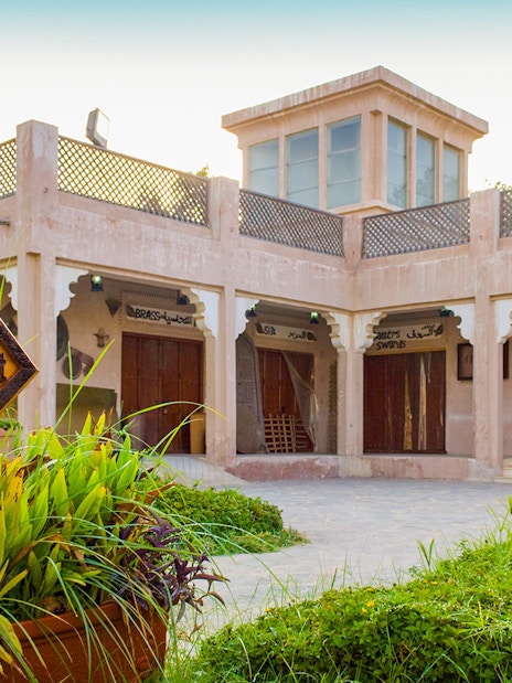 Traditional market sign and buildings in Heritage Village, Abu Dhabi.