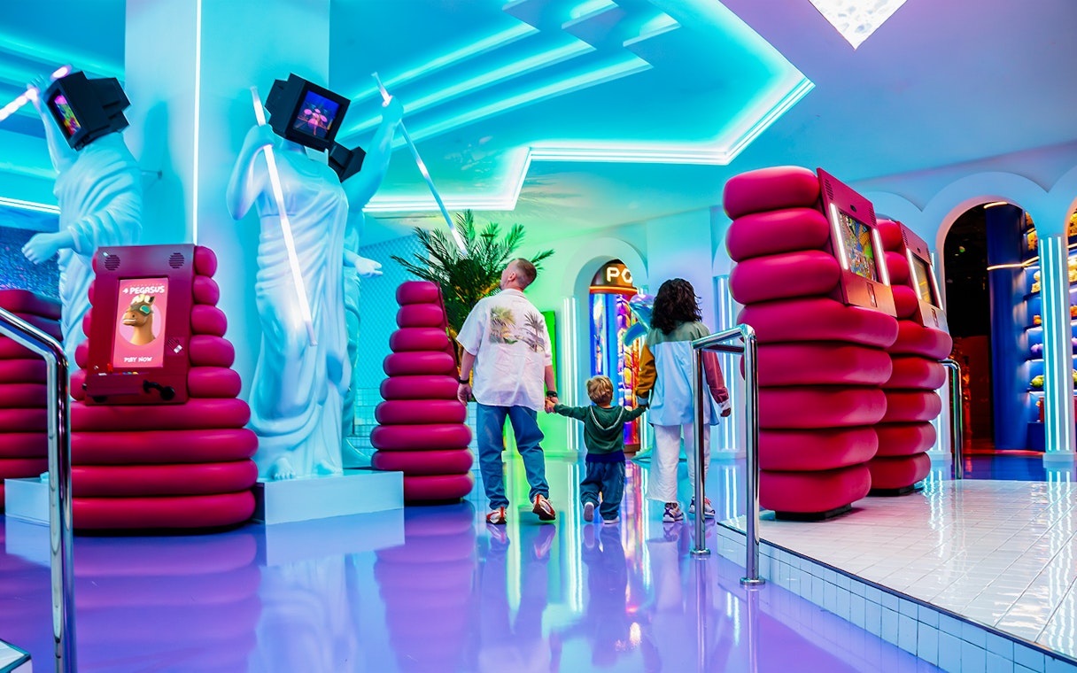 Visitors exploring interactive digital displays at House of Hype.