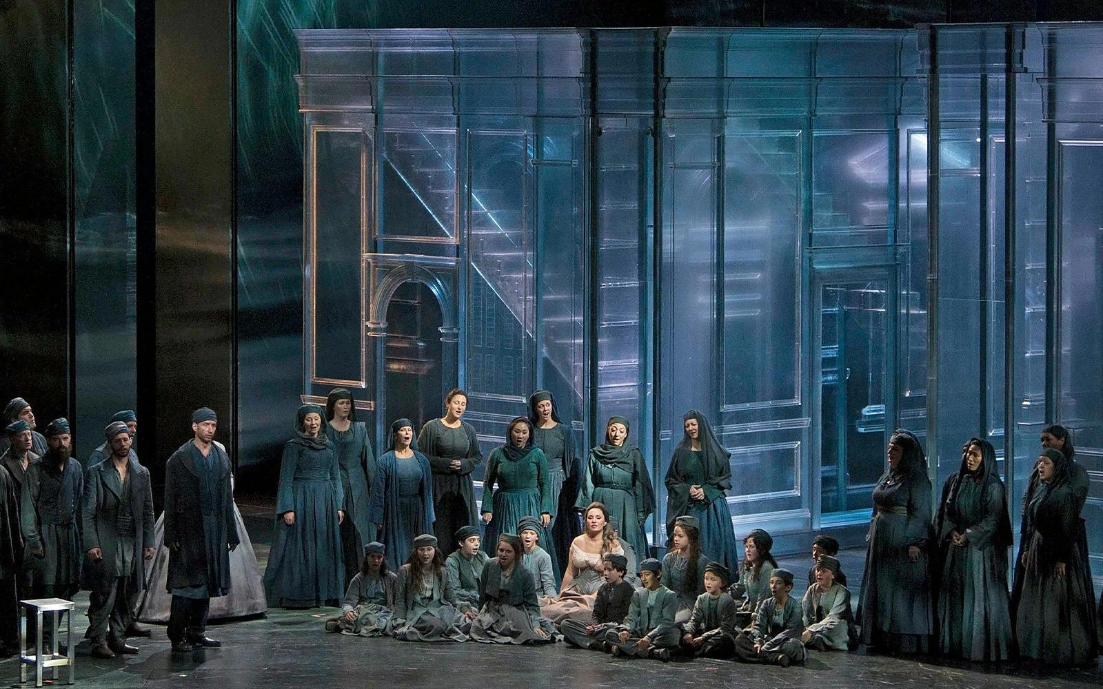 Cast performing Otello on Broadway stage with a modern set design.
