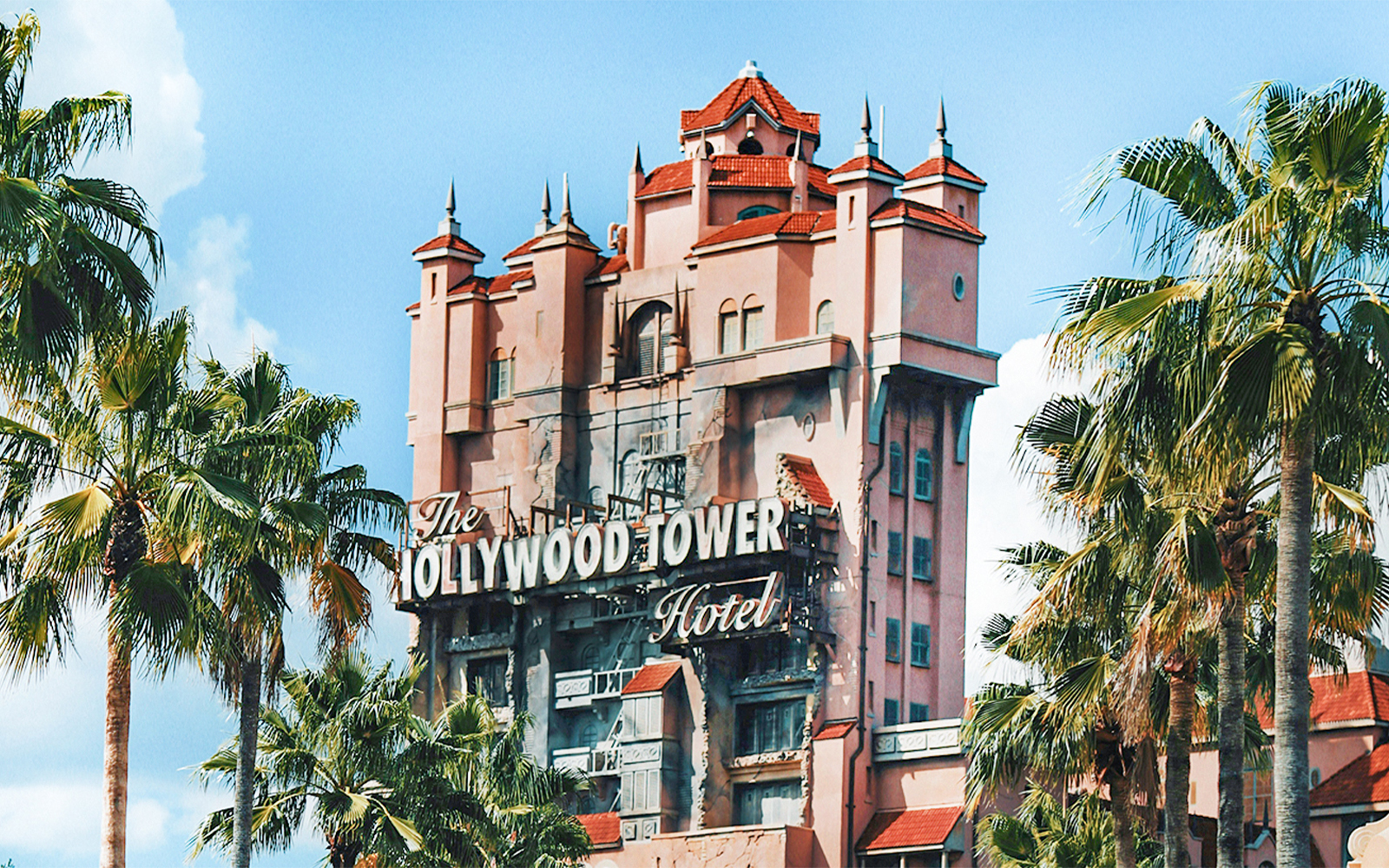 Hollywood Tower at Disney's Hollywood Studios, Walt Disney Resort Orlando, surrounded by palm trees.