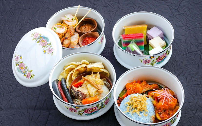 Heritage Peranakan Tingkat meal served on Singapore cable car Sky Dining experience.