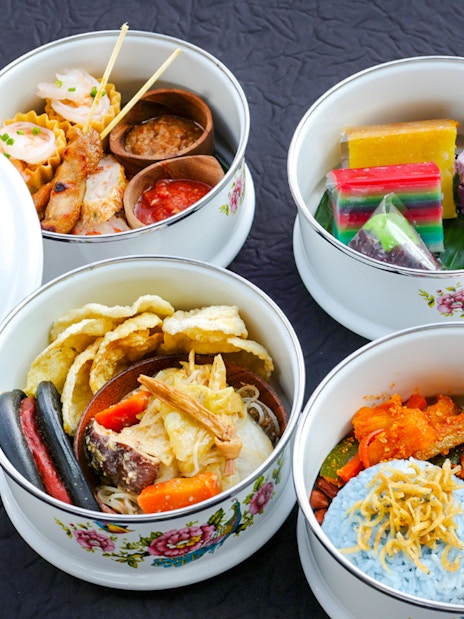 Heritage Peranakan Tingkat meal served on Singapore cable car Sky Dining experience.