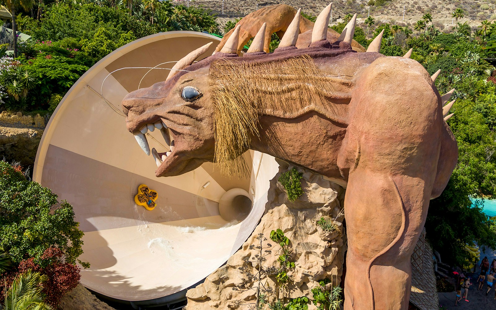 Siam Park water slide with palm trees, part of Combo: Aqualand Costa Adeje + Siam Park Skip-the-Line Tickets, Tenerife.