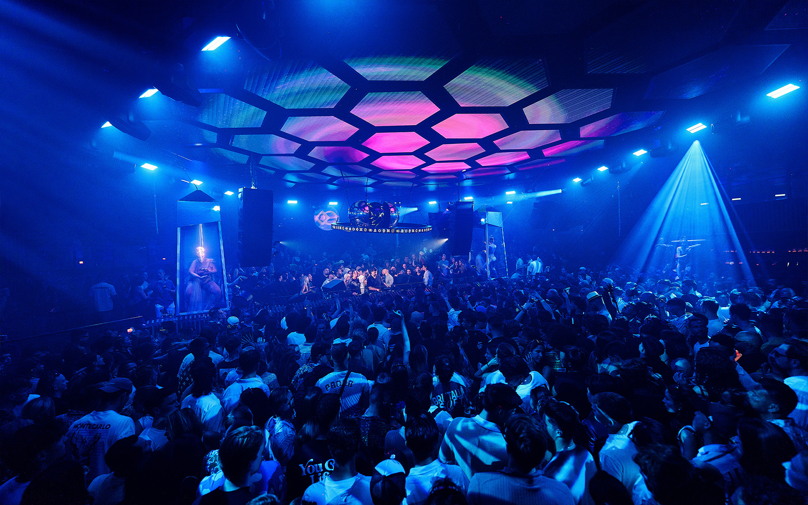 Camelphat performing at Pacha nightclub in Ibiza, vibrant lights and crowd enjoying the music.