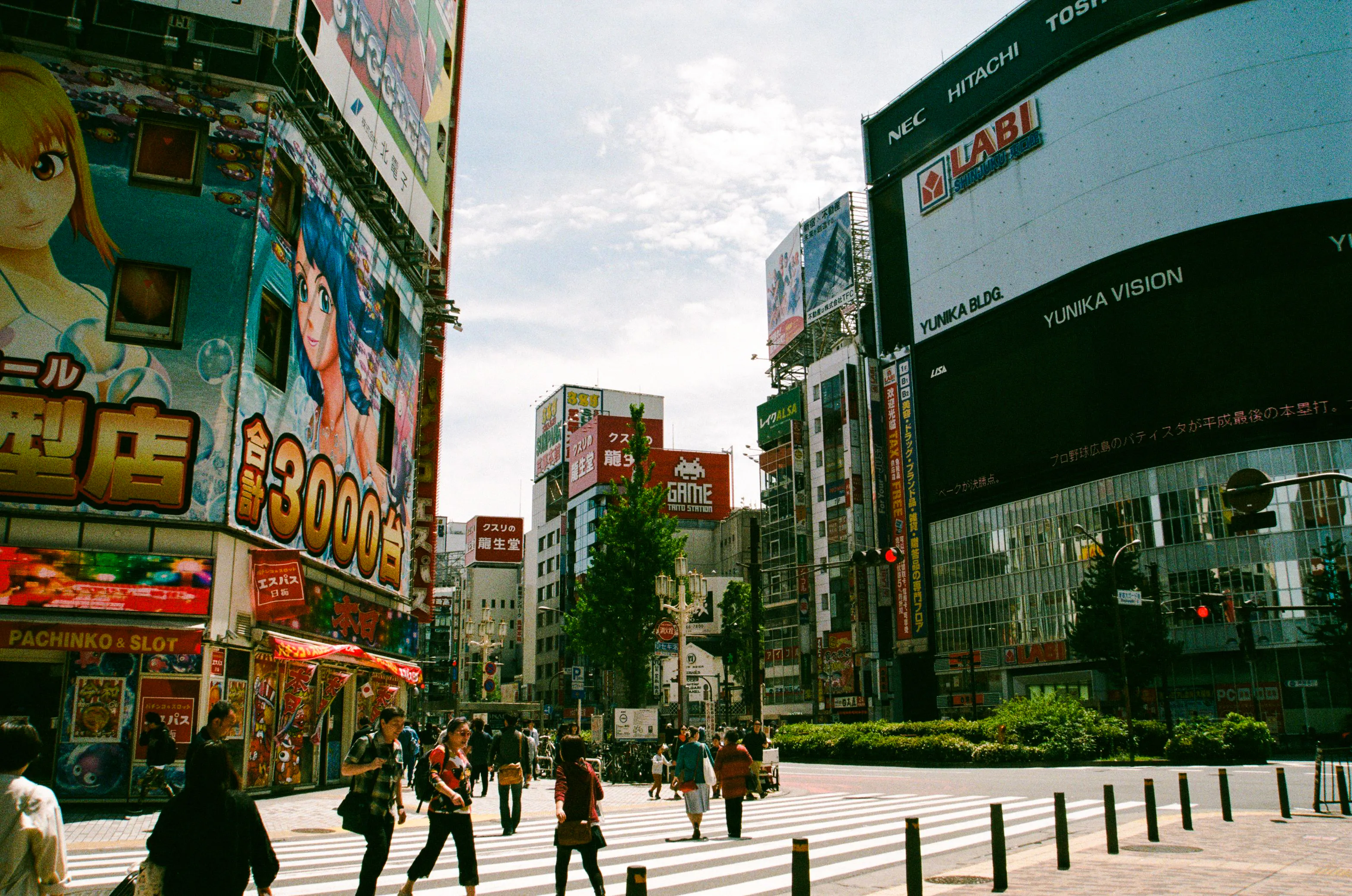 Shibuya street scene with anime billboards, Tokyo Private Pokémon Tour location.