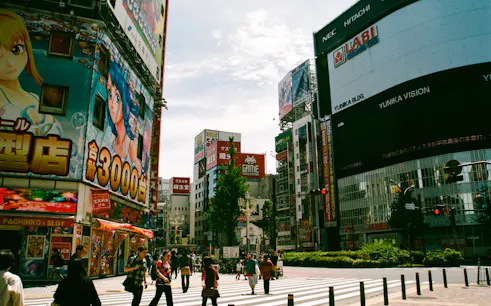Shibuya street scene with anime billboards, Tokyo Private Pokémon Tour location.