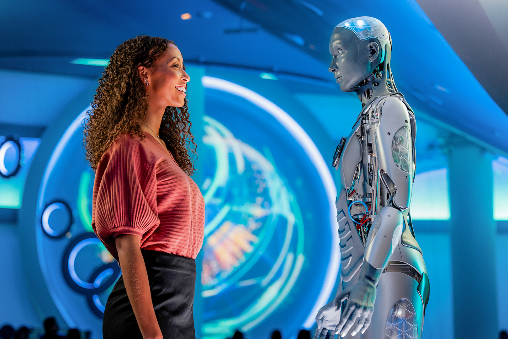 Visitor interacting with a humanoid robot at Sphere, Las Vegas.