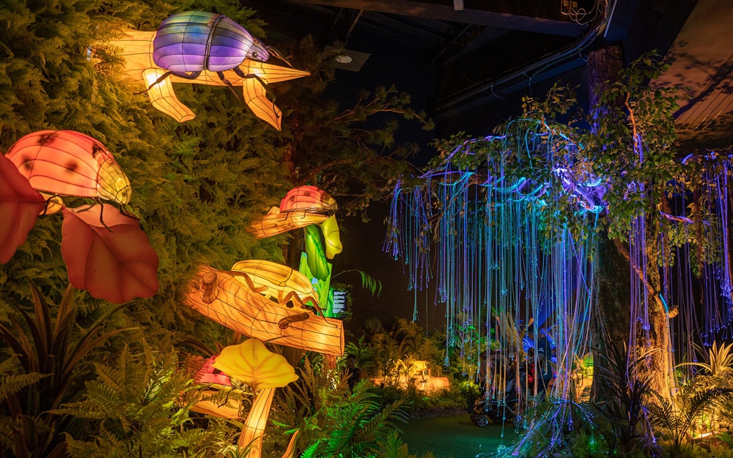 Colorful illuminated animal sculptures and glowing trees at Wetland Studios Putrajaya, Malaysia.
