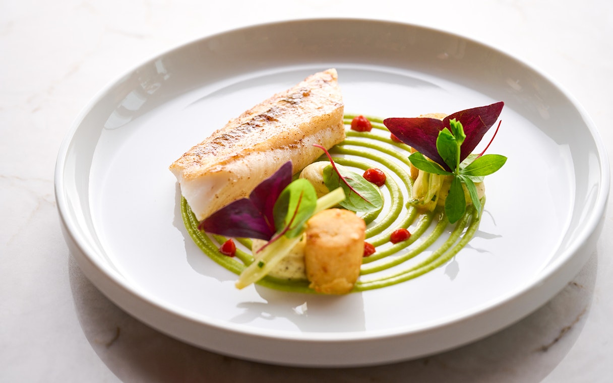Seared fish with green puree and garnishes at At.Mosphere, Burj Khalifa.