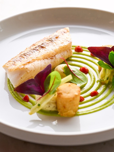 Seared fish with green puree and garnishes at At.Mosphere, Burj Khalifa.