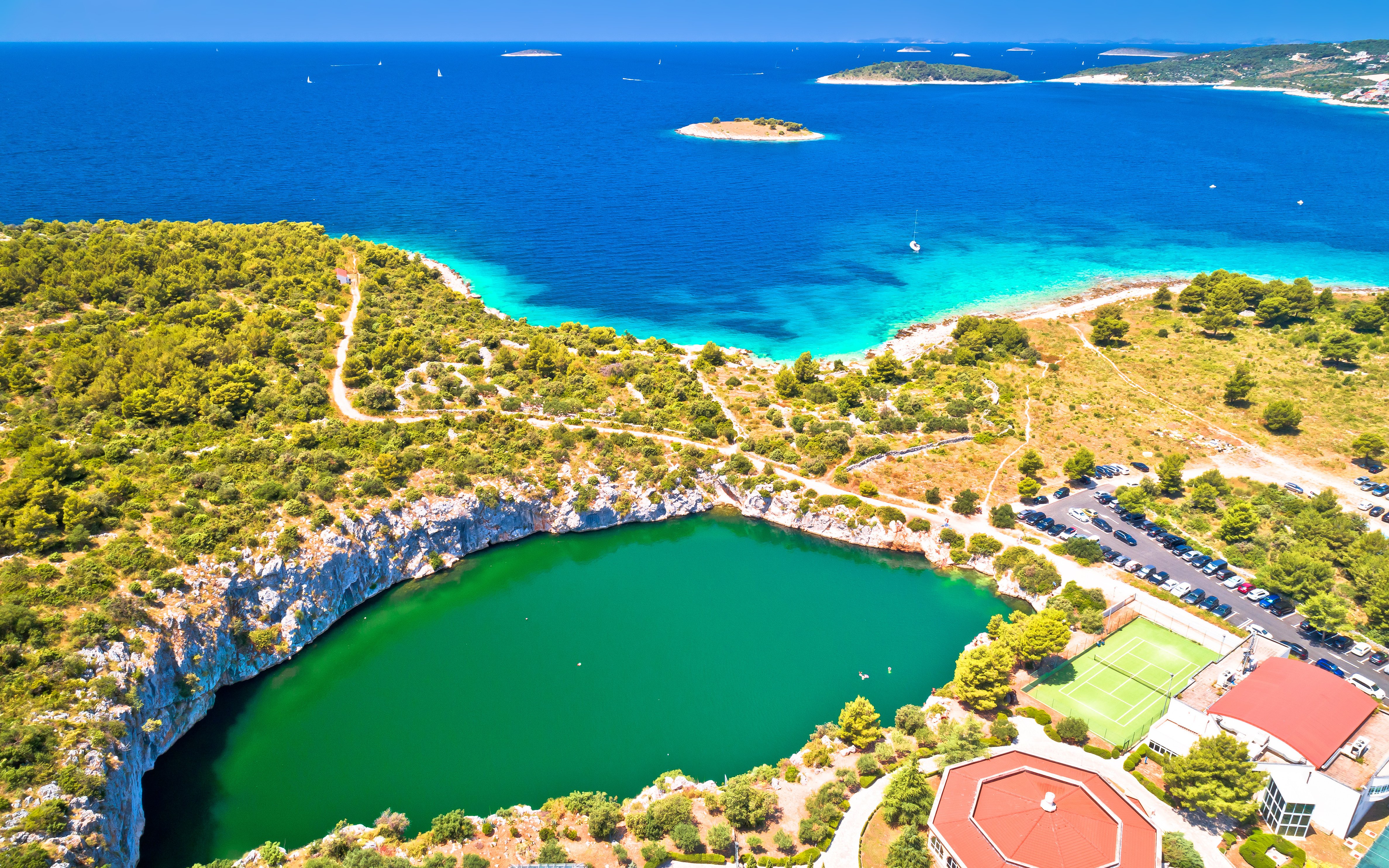 Aerial view of Dragon Eye Lake and turquoise coastline in Rogoznica, Croatia.
