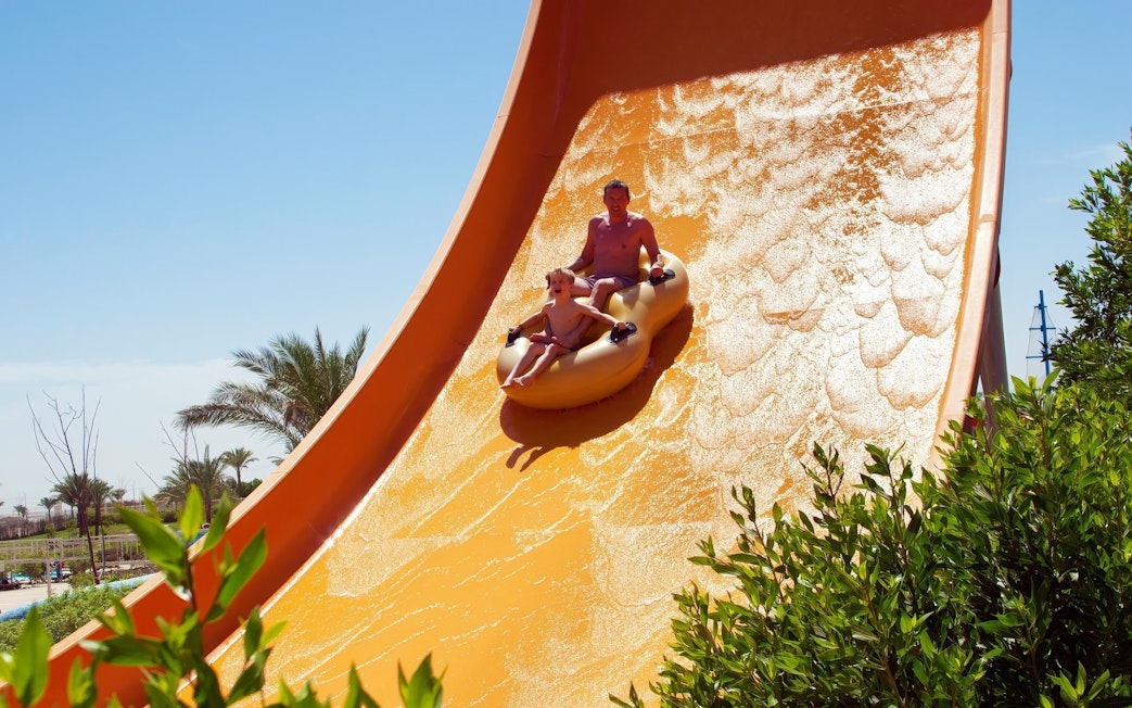 People enjoying wave slide at Makadi Water World, Hurghada.