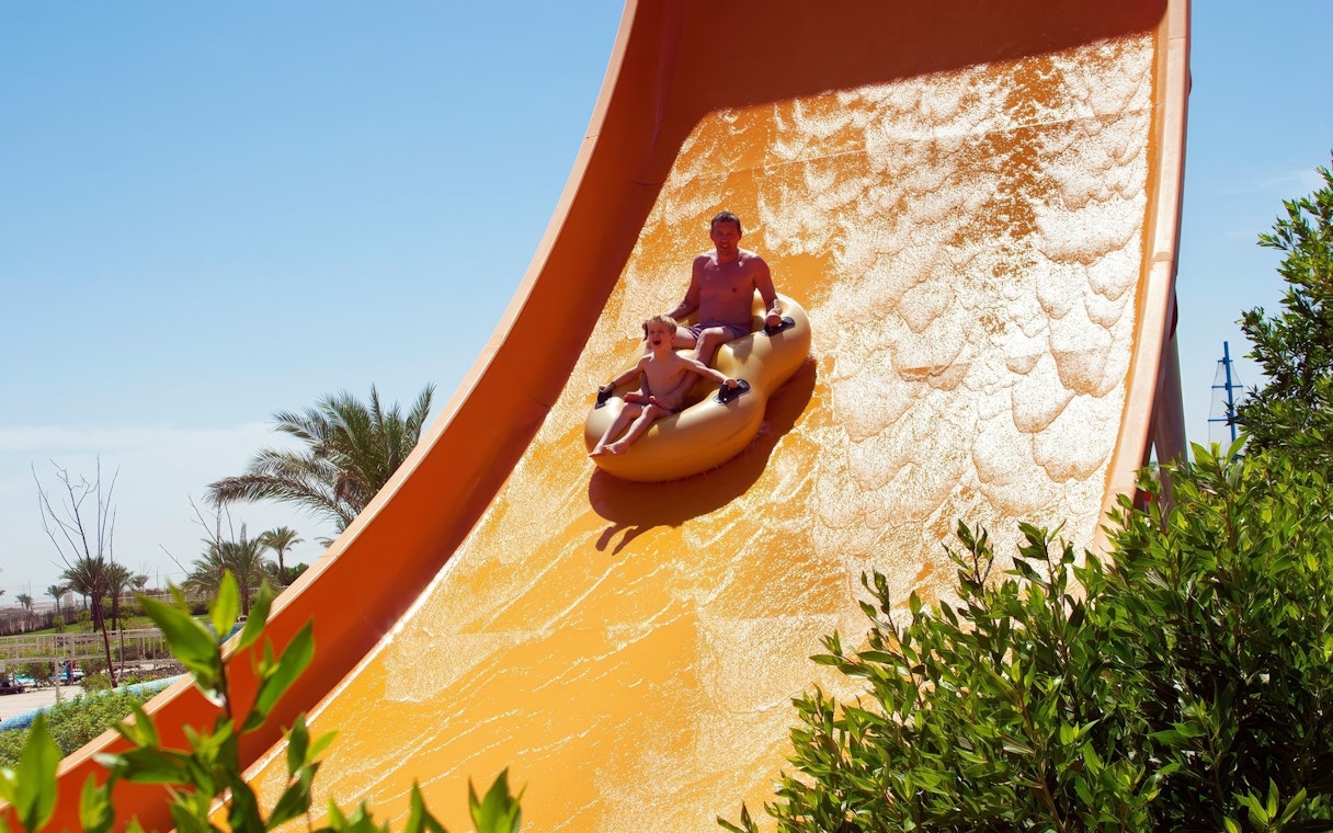 People enjoying wave slide at Makadi Water World, Hurghada.