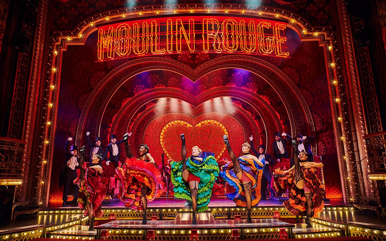 Stage performance of dancers at Moulin Rouge, vibrant costumes, Come Alive Westend.