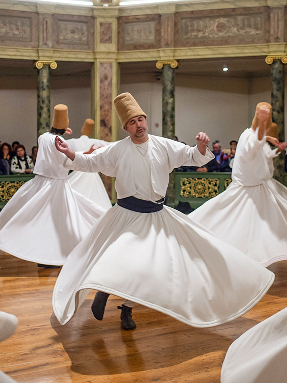 Whirling Dervishes performing traditional dance in Istanbul, Turkey.