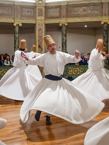 Whirling Dervishes performing traditional dance in Istanbul, Turkey.