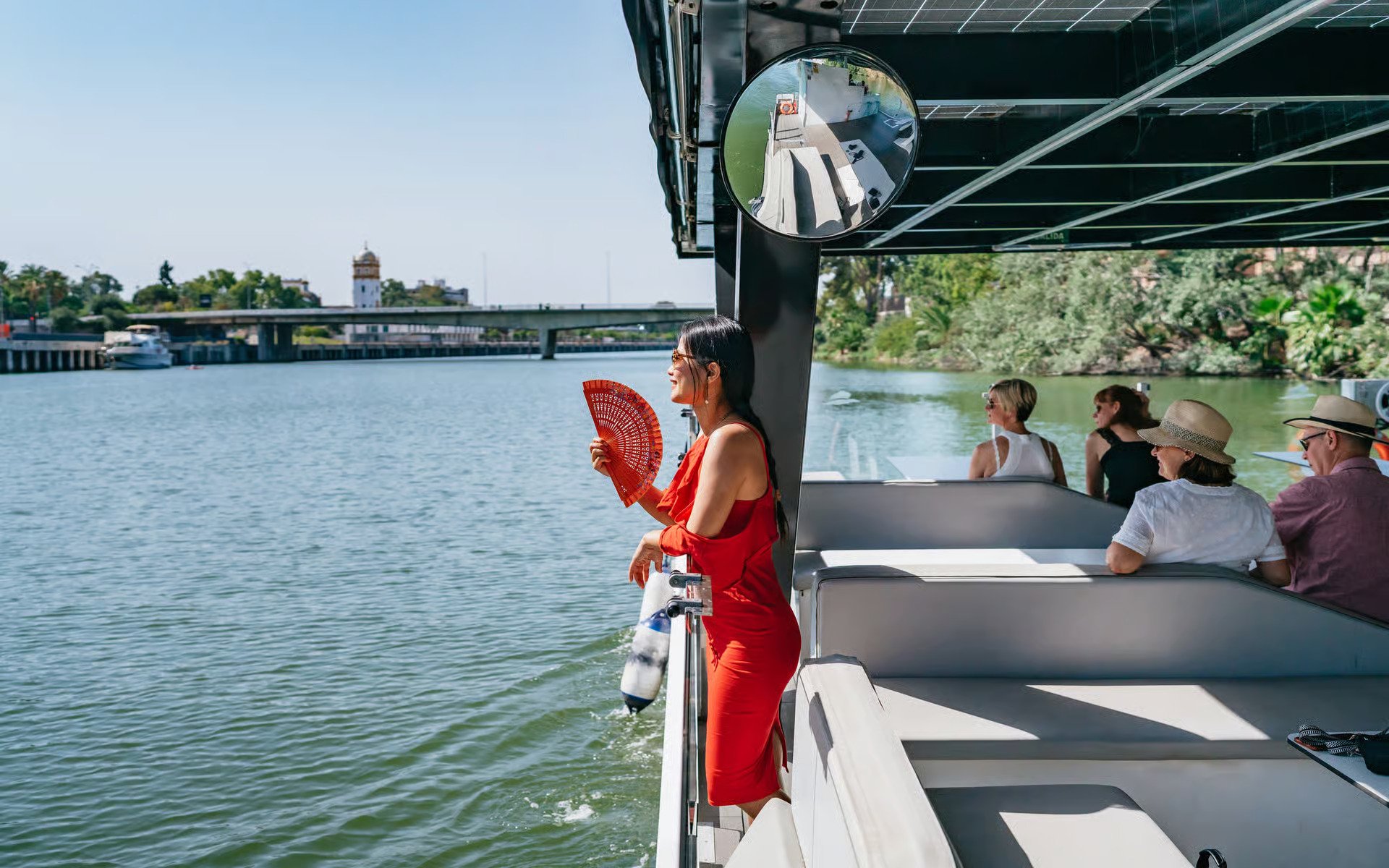 Tourists enjoying an Eco-Friendly Guadalquivir River Cruise in Seville, Spain.