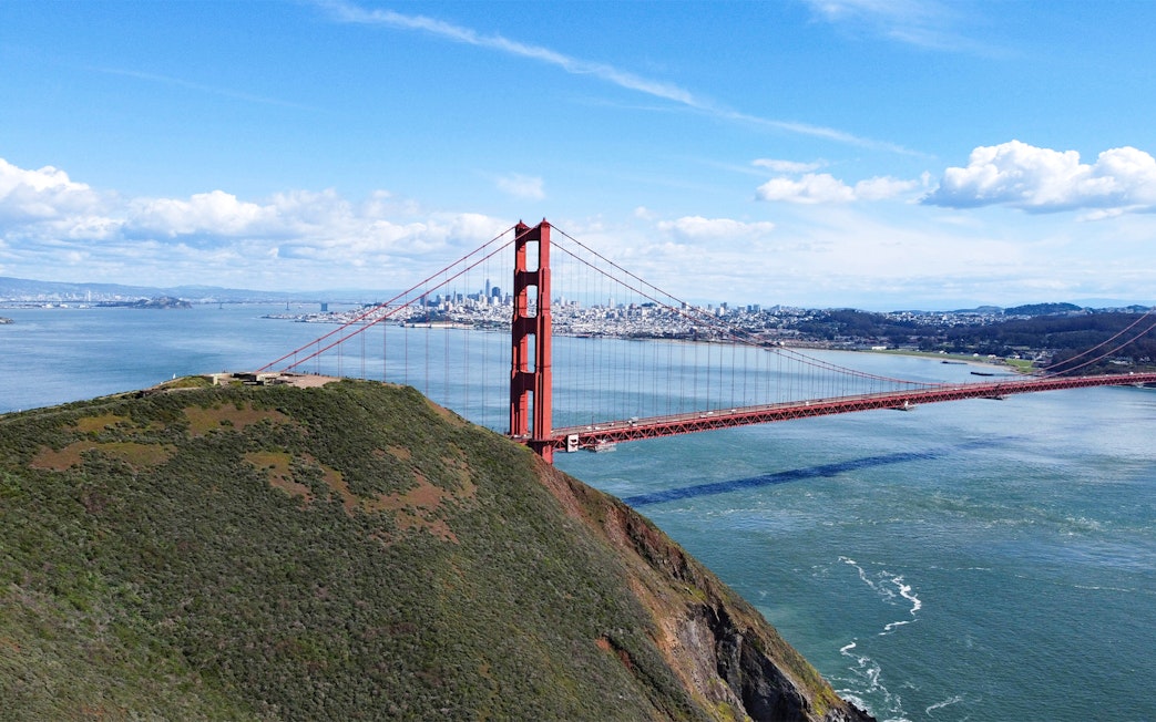 Golden Gate Bridge view with San Francisco skyline from helicopter ride.