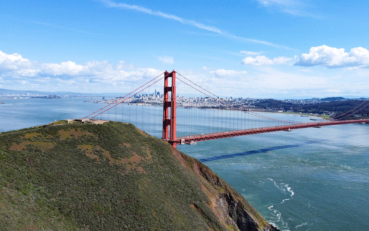 Golden Gate Bridge view with San Francisco skyline from helicopter ride.