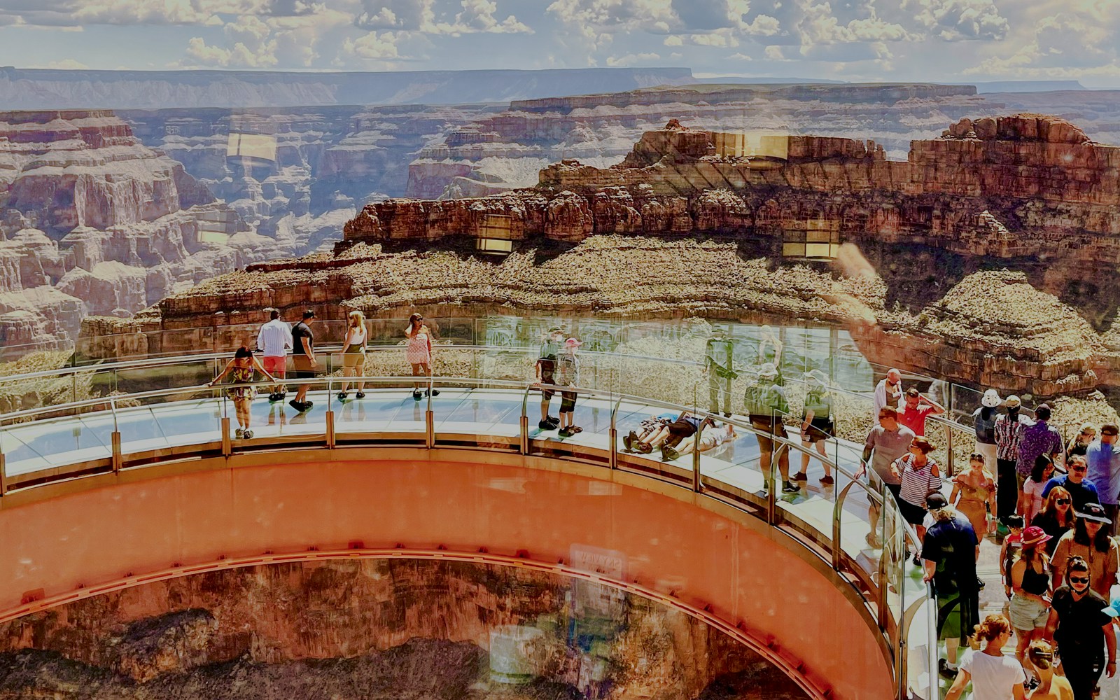 Grand Canyon Skywalk extending over canyon with tourists viewing landscape, near Hoover Dam, Las Vegas.