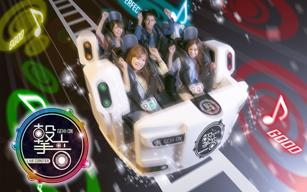 Thrill-seekers enjoying an indoor roller coaster at Tokyo Joypolis Theme Park, Japan.