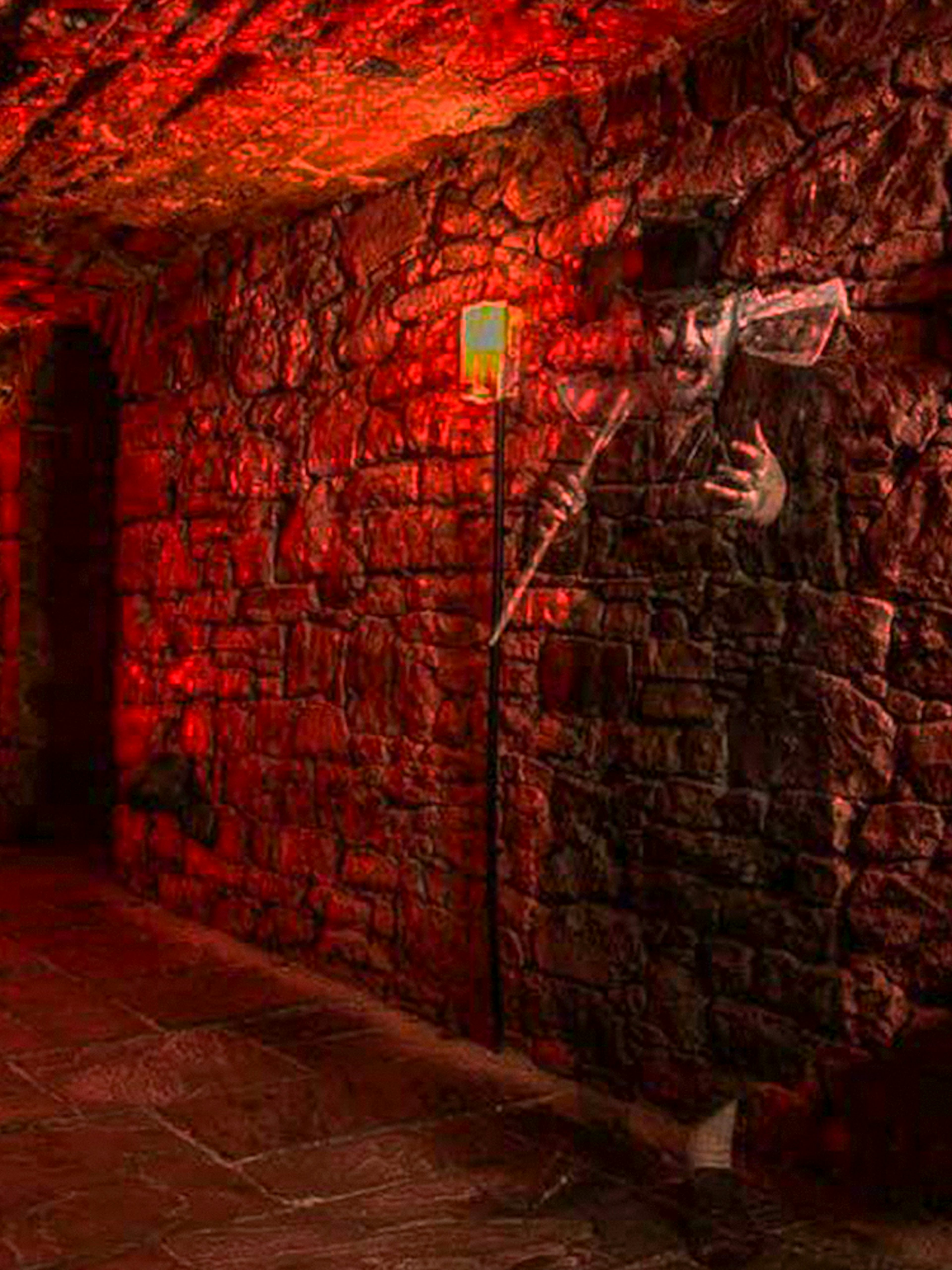 Underground stone corridor with ghostly figure on a famous ghost tour.
