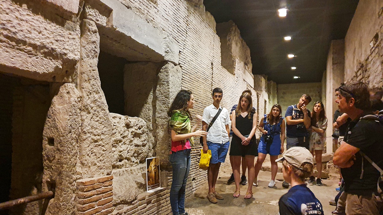 Visitors exploring Catacombs of San Gaudioso in Naples during day.