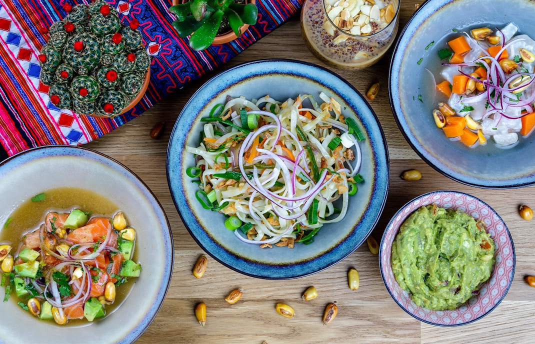 Valletta street with outdoor dining, showcasing Peruvian cuisine in Malta.