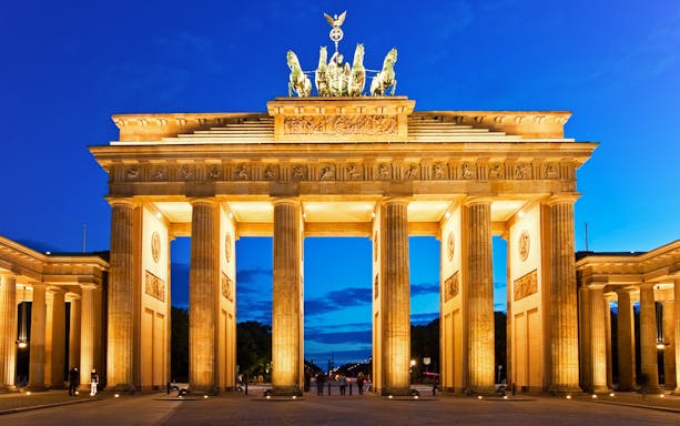 Brandenburg Gate illuminated at night in Berlin, Germany.