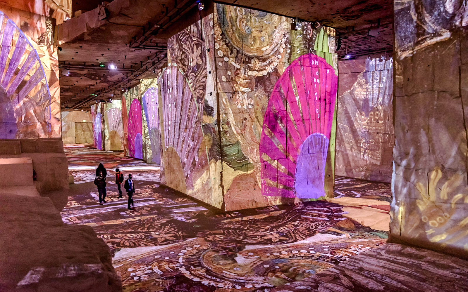 Frida Kahlo artwork projected on walls at Carrières des Lumières, Paris exhibition.