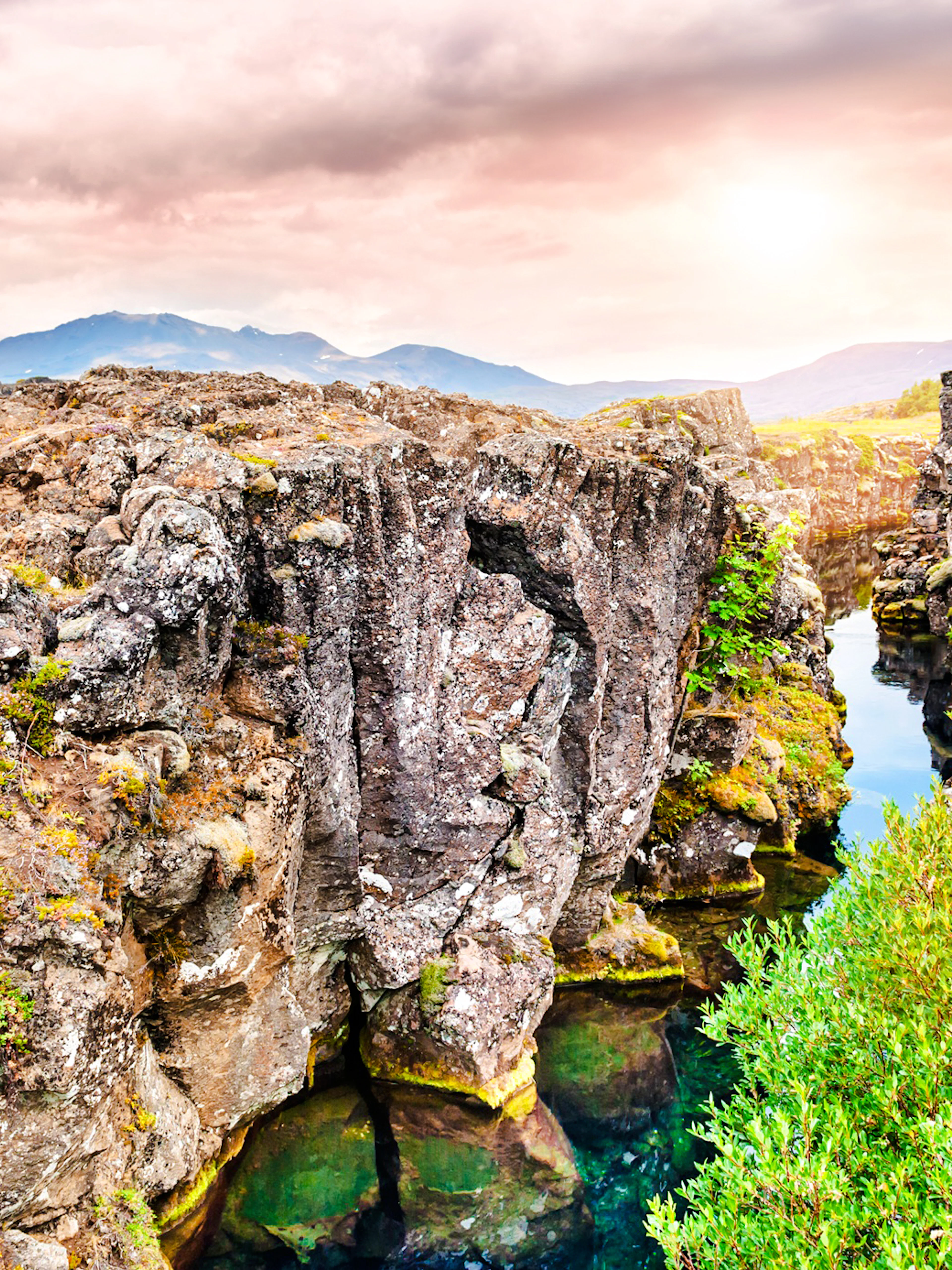 Rugged cliffs and clear water at Þingvellir National Park, part of the Golden Circle tour, Reykjavik.
