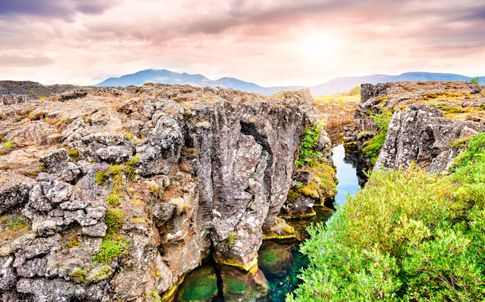 Rugged cliffs and clear water at Þingvellir National Park, part of the Golden Circle tour, Reykjavik.