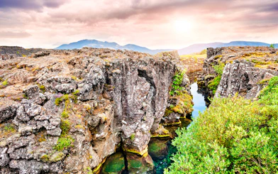 Rugged cliffs and clear water at Þingvellir National Park, part of the Golden Circle tour, Reykjavik.