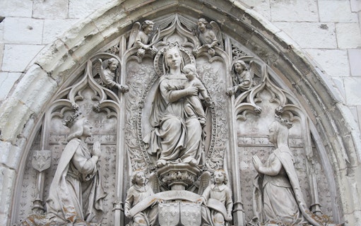 Royal Amboise Castle stone relief with religious figures and intricate carvings.