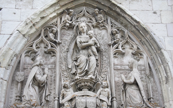 Royal Amboise Castle stone relief with religious figures and intricate carvings.