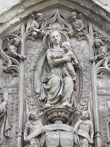 Royal Amboise Castle stone relief with religious figures and intricate carvings.