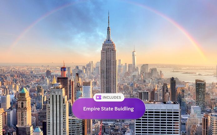 Empire State Building with city skyline and rainbow in New York City.
