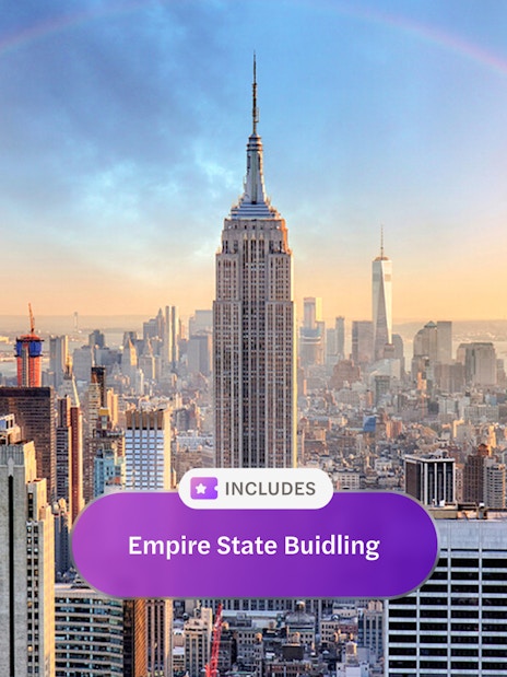 Empire State Building with city skyline and rainbow in New York City.